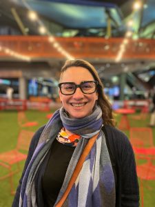 Abby, woman living with PSP, smiles to the camera