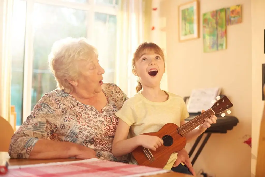 ParkinSong singing group - Elderly woman and child singing together