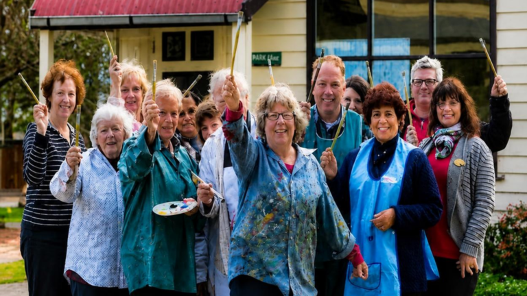 Photo of members of Painting with Parkinson’s with Anne in the centre