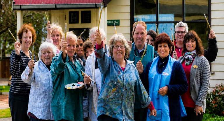 Photo of members of Painting with Parkinson’s with Anne in the centre